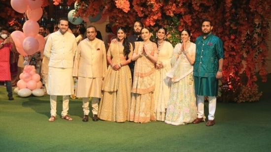The Ambani family posed with the bride-to-be and the groom-to-be in front of Antilia and greeted the photographers outside their residence. (Hindustan Times)