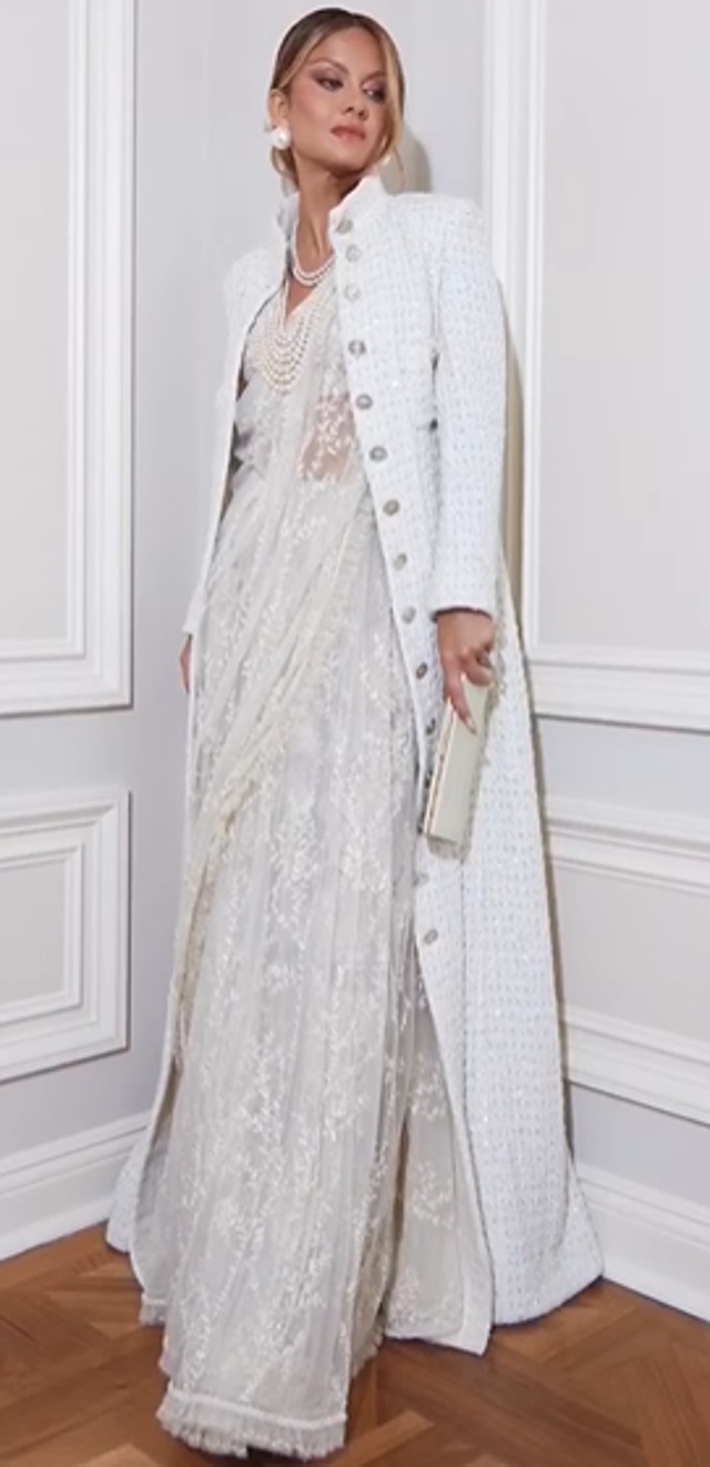 Natasha Poonawala layers a long tweed jacket over her ivory saree (Photo: Instagram) Natasha Poonawala layers a long tweed jacket over her ivory saree (Photo: Instagram)