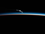 The image, shared by ISS, shows the lingering launch plume of the SpaceX Falcon.