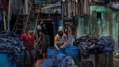 Workers seen dying clothes in the by-lanes of Kamathipura, on January 6. There are around 8,000 tenants and 4,000 land owners in Kamathipura, who live in dilapidated structures sized 40 square feet to 100 square feet. Most of the buildings are cessed, which protects tenants from rental hikes or eviction, leading to non-maintenance by landlords. At least 123 buildings in Kamathipura have been classified by MHADA as “beyond repair”, HT reported.&nbsp; (Satish Bate / HT Photo)
