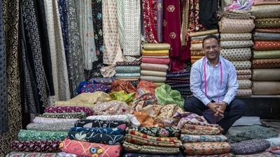 Salim Ansari, secretary of KP Market Association, seen at his cloth shop at KP Market, Kamathipura. In one of the 15 lanes alone, there are 200 shops, he tells HT. Given the odour of sleaze attached to the name Kamathipura, the cloth traders have renamed their area as KP Market.&nbsp; (Satish Bate / HT Photo)