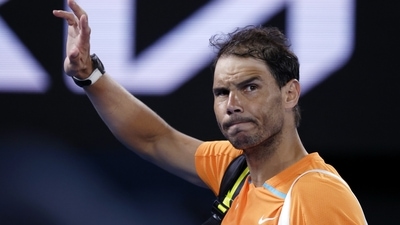 Rafael Nadal of Spain waves as he leaves Rod Laver Arena following his second round loss to Mackenzie McDonald of the U.S. at the Australian Open tennis championship in Melbourne, Australia, Wednesday, Jan. 18, 2023. (AP) Rafael Nadal of Spain waves as he leaves Rod Laver Arena following his second round loss to Mackenzie McDonald of the U.S. at the Australian Open tennis championship in Melbourne, Australia, Wednesday, Jan. 18, 2023. (AP)