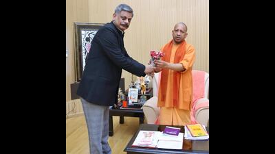Deen Dayal Upadhyaya Gorakhpur University vice-chancellor Rajesh Singh with chief minister Yogi Adityanath in Lucknow on Friday (HT Photo) Deen Dayal Upadhyaya Gorakhpur University vice-chancellor Rajesh Singh with chief minister Yogi Adityanath in Lucknow on Friday (HT Photo)