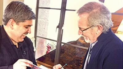 Director Steven Spielberg signing a copy of the book Jaws: Memories from Martha’s Vineyard in 2013 Director Steven Spielberg signing a copy of the book Jaws: Memories from Martha’s Vineyard in 2013