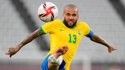 FILE - Brazil's Dani Alves kicks the ball during a men's soccer semifinal match at the 2020 Summer Olympics, Tuesday, Aug. 3, 2021, in Kashima, Japan. Brazilian soccer player Dani Alves has been arrested after being accused of sexually abusing a woman in Barcelona it was reported on Friday, Jan. 20, 2023. Police say the alleged act took place on Dec. 31 at a night club in Barcelona. (AP Photo/Andre Penner, File) (AP) FILE - Brazil's Dani Alves kicks the ball during a men's soccer semifinal match at the 2020 Summer Olympics, Tuesday, Aug. 3, 2021, in Kashima, Japan. Brazilian soccer player Dani Alves has been arrested after being accused of sexually abusing a woman in Barcelona it was reported on Friday, Jan. 20, 2023. Police say the alleged act took place on Dec. 31 at a night club in Barcelona. (AP Photo/Andre Penner, File) (AP)