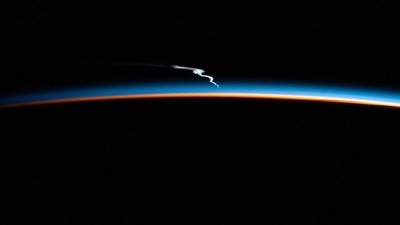 The image, shared by ISS, shows the lingering launch plume of the SpaceX Falcon. (Instagram/@iss)