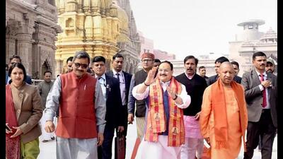 Uttar Pradesh chief minister Yogi Adityanath with BJP national president JP Nadda and others visits the Kashi Vishwanath Temple, in Varanasi, Friday. (PTI Photo)