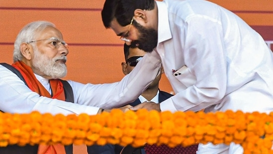 Prime Minister Narendra Modi with Maharashtra Chief Minister Eknath Shinde at the launch of development projects and transfers benefits under PM-SVANidhi, in Mumbai, Thursday, (PTI)