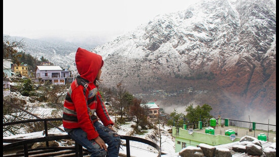 Snow-capped mountain peaks after fresh snowfall in Joshimath on Friday. (PTI)