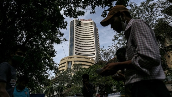 Sensex slumps by over 200 points to end day at 60,622, Nifty closes in red above 18,000.(Bloomberg)