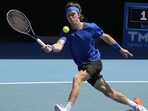 Andrey Rublev of Russia plays a forehand return to Daniel Evans of Britain during their third round match at the Australian Open tennis championship in Melbourne, Australia, Saturday, Jan. 21, 2023. (AP) Andrey Rublev of Russia plays a forehand return to Daniel Evans of Britain during their third round match at the Australian Open tennis championship in Melbourne, Australia, Saturday, Jan. 21, 2023. (AP)