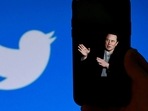 A phone screen displays a photo of Elon Musk with the Twitter logo shown in the background, in Washington, DC.(AFP) A phone screen displays a photo of Elon Musk with the Twitter logo shown in the background, in Washington, DC.(AFP)