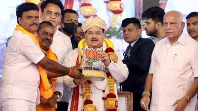 BJP national president JP Nadda being presented with the memento by party supporters during a public meeting, in Vijayapura. (Jagat Prakash Nadda Twitter) BJP national president JP Nadda being presented with the memento by party supporters during a public meeting, in Vijayapura. (Jagat Prakash Nadda Twitter)