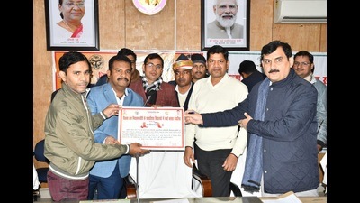 District education officials being felicitated by Kheri DM and CDO for making Nighasan block a smart block (HT Photo)