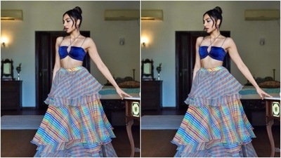 Sobhita looked every bit gorgeous in the blue silk blouse with a plunging neckline, halter-neck and slip details, and backless patterns. She teamed it with a long tiered and checkered organza skirt featuring multicoloured shades. (Instagram/@sobhitad) Sobhita looked every bit gorgeous in the blue silk blouse with a plunging neckline, halter-neck and slip details, and backless patterns. She teamed it with a long tiered and checkered organza skirt featuring multicoloured shades. (Instagram/@sobhitad)