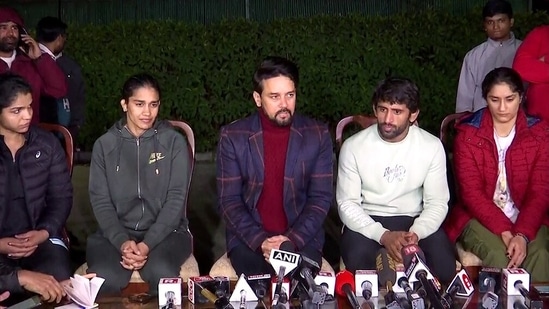 Union Minister of Sports and Youth Affairs Anurag Thakur along with wrestlers Bajrang Punia, Vinesh Phogat, Sakshee Malikkh and Babita Phogat addresses a joint press conference regarding the wrestlers' protest against the Wrestling Federation of India (WFI) and its chief Brij Bhushan Sharan Singh against whom sexual harassment allegations were made, at his residence, in New Delhi on Friday. (ANI Photo)(ANI)