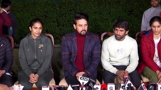 Union Minister of Sports and Youth Affairs Anurag Thakur along with wrestlers Bajrang Punia, Vinesh Phogat, Sakshee Malikkh and Babita Phogat addresses a joint press conference regarding the wrestlers' protest against the Wrestling Federation of India (WFI) and its chief Brij Bhushan Sharan Singh against whom sexual harassment allegations were made, at his residence, in New Delhi on Friday. (ANI Photo)(ANI)
