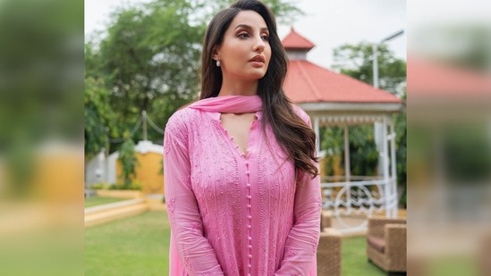 Nora Fatehi waved her hair and left it open. Acing her expressions, she struck some stunning poses for the gram. (Instagram/@norafatehi)