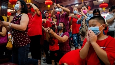 Meanwhile, the crowds praying for good fortune at the historic Longshan Temple in Taipei, the capital of Taiwan, were smaller than a year ago even as the pandemic has eased.&nbsp; (REUTERS)