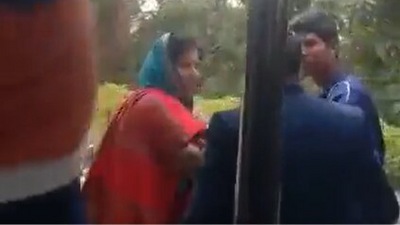 In the video, the woman is purportedly seen being moved out of the residence by a male staff member.