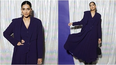 Sonam posted the photoshoot on her Instagram page with a quote by Diana Vreeland, "You gotta have style. It helps you get down the stairs. It helps you get up in the morning. It's a way of life." Regarding the outfit details, Sonam's deep purple three-piece set features an elongated storm flap trench coat, a button-down waistcoat, and a flared midi skirt. (Instagram) Sonam posted the photoshoot on her Instagram page with a quote by Diana Vreeland, "You gotta have style. It helps you get down the stairs. It helps you get up in the morning. It's a way of life." Regarding the outfit details, Sonam's deep purple three-piece set features an elongated storm flap trench coat, a button-down waistcoat, and a flared midi skirt. (Instagram)