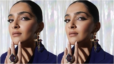 In the end, Sonam styled the look with black suede boots, a matching top handle black bag, precious stone-adorned cross-shaped earrings and matching statement rings. A centre-parted braided hairdo, subtle eye shadow, winged eyeliner, nude lip shade, feathered brows and blushed cheeks rounded it all off. (Instagram) In the end, Sonam styled the look with black suede boots, a matching top handle black bag, precious stone-adorned cross-shaped earrings and matching statement rings. A centre-parted braided hairdo, subtle eye shadow, winged eyeliner, nude lip shade, feathered brows and blushed cheeks rounded it all off. (Instagram)