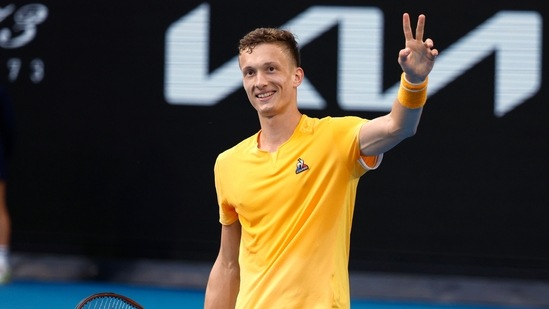 Jiri Lehecka of the Czech Republic celebrates after defeating Felix Auger-Aliassime of Canada during their fourth round match at the Australian Open tennis championship in Melbourne, Australia, Sunday, Jan. 22, 2023.(AP)