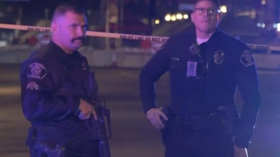 Screenshot from a viodeo shows police officers standing guard at the scene of a shooting at Monterey Park, California. TNLA/Handout via REUTERS