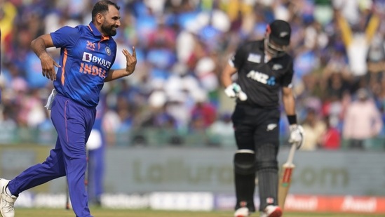 India's Mohammed Shami, left, celebrates the dismissal of New Zealand's Daryl Mitchell, right, during the second one-day international cricket match between India and New Zealand in Raipur.(AP)