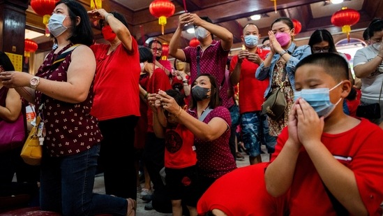 Meanwhile, the crowds praying for good fortune at the historic Longshan Temple in Taipei, the capital of Taiwan, were smaller than a year ago even as the pandemic has eased.&nbsp;(REUTERS)