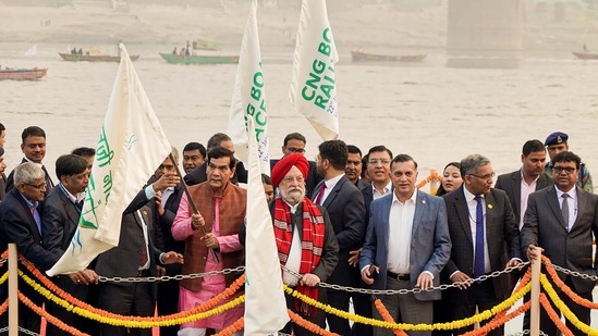 Union Petroleum Minister Hardeep Singh Puri with Uttar Pradesh Minister AK Sharma flag off the CNG Boat Race, at Varanasi Namo Ghat.(PTI)