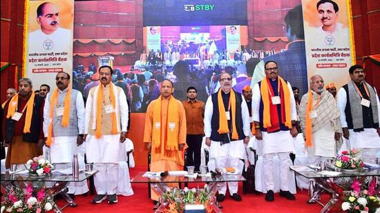Uttar Pradesh chief minister Yogi Adityanath and other BJP leaders at the party’s state working committee meeting in Lucknow on Sunday. (ANI PHOTO)