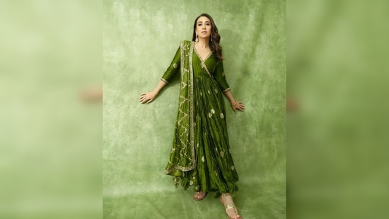 Karisma Kapoor donned a green banarasi silk crushed anarkali set from the collection of designer Punit Balana's label. (Instagram/@therealkarismakapoor)