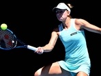 Magda Linette hits a return against Caroline Garcia during their women's singles match on day eight of the Australian Open(AFP) Magda Linette hits a return against Caroline Garcia during their women's singles match on day eight of the Australian Open(AFP)