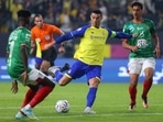 Al Nassr's Portuguese forward Cristiano Ronaldo (C) attempts a shot during the Saudi Pro League football match between Al-Nassr and Al-Ettifaq at the King Fahd Stadium in the Saudi capital Riyadh.(AFP) Al Nassr's Portuguese forward Cristiano Ronaldo (C) attempts a shot during the Saudi Pro League football match between Al-Nassr and Al-Ettifaq at the King Fahd Stadium in the Saudi capital Riyadh.(AFP)