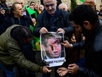 Protesters burn a portrait of Rasmus Paludan, leader of Danish far-right political party Hard Line, in front of the Consulate General of Sweden in Istanbul on January 22, 2023, after Rasmus Paludan, who also has Swedish citizenship, burned a copy of the Koran near the Turkish Embassy in Stockholm. - Sweden's prime minister has condemned as "deeply disrespectful" the weekend burning of a Koran in Stockholm, which has raised tensions with Turkey as the Nordic country courts Ankara over its NATO bid. (Photo by Yasin AKGUL / AFP) Protesters burn a portrait of Rasmus Paludan, leader of Danish far-right political party Hard Line, in front of the Consulate General of Sweden in Istanbul on January 22, 2023, after Rasmus Paludan, who also has Swedish citizenship, burned a copy of the Koran near the Turkish Embassy in Stockholm. - Sweden's prime minister has condemned as "deeply disrespectful" the weekend burning of a Koran in Stockholm, which has raised tensions with Turkey as the Nordic country courts Ankara over its NATO bid. (Photo by Yasin AKGUL / AFP)