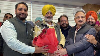 Amarjeet Singh Sidhu (left) being congratulated by Chandigarh BJP president Arun Sood (right) at the MC office in Sector 68, Mohali, on Monday (Sanjeev Sharma/HT) Amarjeet Singh Sidhu (left) being congratulated by Chandigarh BJP president Arun Sood (right) at the MC office in Sector 68, Mohali, on Monday (Sanjeev Sharma/HT)