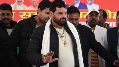 Wrestling Federation of India (WFI) president Brij Bhushan Sharan Singh (C) arrives to address a press conference in Gonda following allegations of sexual harassment to wrestlers by members of the WFI. (Photo by AFP) (AFP) Wrestling Federation of India (WFI) president Brij Bhushan Sharan Singh (C) arrives to address a press conference in Gonda following allegations of sexual harassment to wrestlers by members of the WFI. (Photo by AFP) (AFP)