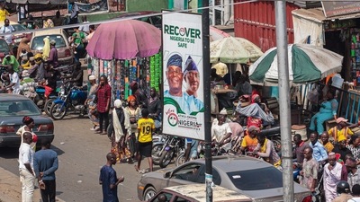People walk past a campaign poster of Atiku Abubakar (L on poster), presidential candidate of the People's Democratic Party, in a street in Ibadan, south-west of Nigeria on January 17. (AFP) People walk past a campaign poster of Atiku Abubakar (L on poster), presidential candidate of the People's Democratic Party, in a street in Ibadan, south-west of Nigeria on January 17. (AFP)