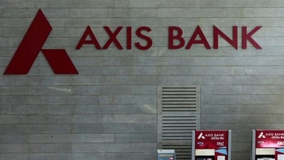 Axis Bank's logo is seen next to ATM machines at its corporate headquarters in Mumbai. (REUTERS Photo)