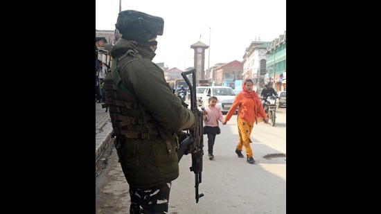 A Central Reserve Police Force man stands guard at Lal Chowk as security is beefed up for the upcoming Republic Day, in Srinagar on Monday. (ANI)