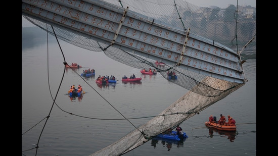 A forensic science laboratory report revealed that rusty cables, broken anchor pins and loose bolts were among the lapses that were not addressed while renovating the suspension bridge. (AP)