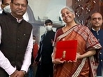 Union Finance Minister Nirmala Sitharaman along with the Ministers of State for Finance Pankaj Chaudhary and Bhagwat Karad arrives at Parliament ahead of the Union Budget 2022-23 presentation in Lok Sabha, in New Delhi on Tuesday. (Amlan Paliwal) Union Finance Minister Nirmala Sitharaman along with the Ministers of State for Finance Pankaj Chaudhary and Bhagwat Karad arrives at Parliament ahead of the Union Budget 2022-23 presentation in Lok Sabha, in New Delhi on Tuesday. (Amlan Paliwal)