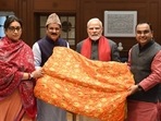 PM Modi hands over ‘chadar’ to be offered on 811th Urs of Khwaja Moinuddin Chishti. (Twitter) PM Modi hands over ‘chadar’ to be offered on 811th Urs of Khwaja Moinuddin Chishti. (Twitter)