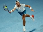 Russia's Karen Khachanov hits a return against USA's Sebastian Korda during their men's singles quarter-final match on day nine of the Australian Open tennis tournament in Melbourne on January 24, 2023. (Photo by DAVID GRAY / AFP) / -- IMAGE RESTRICTED TO EDITORIAL USE - STRICTLY NO COMMERCIAL USE --(AFP) Russia's Karen Khachanov hits a return against USA's Sebastian Korda during their men's singles quarter-final match on day nine of the Australian Open tennis tournament in Melbourne on January 24, 2023. (Photo by DAVID GRAY / AFP) / -- IMAGE RESTRICTED TO EDITORIAL USE - STRICTLY NO COMMERCIAL USE --(AFP)