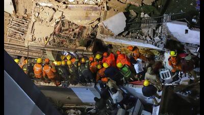 A rescue operation underway after a residential building collapsed on Wazir Hasan Road, in Lucknow on Tuesday. (ANI Photo) A rescue operation underway after a residential building collapsed on Wazir Hasan Road, in Lucknow on Tuesday. (ANI Photo)