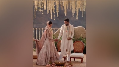 Regarding Athiya's wedding look, the actor chose a subtle pink Chikankari lehenga made in silk with zardozi and jaali work. She styled it with a veil and dupatta made of silk organza replete with intricate handiwork. According to Anamika Khanna, her lehenga took "approximately 10,000 hours to make." (Instagram) Regarding Athiya's wedding look, the actor chose a subtle pink Chikankari lehenga made in silk with zardozi and jaali work. She styled it with a veil and dupatta made of silk organza replete with intricate handiwork. According to Anamika Khanna, her lehenga took "approximately 10,000 hours to make." (Instagram)