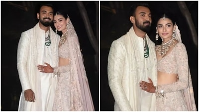 After tying the knot, the couple stepped outside their wedding venue to pose for the paparazzi waiting outside Suniel Shetty's farmhouse. The pictures gave a glimpse of their subtle and exquisite ensemble. Additionally, Athiya and KL will soon host a grand reception in Mumbai for their friends and colleagues before the Indian Premier League (IPL). (Instagram) After tying the knot, the couple stepped outside their wedding venue to pose for the paparazzi waiting outside Suniel Shetty's farmhouse. The pictures gave a glimpse of their subtle and exquisite ensemble. Additionally, Athiya and KL will soon host a grand reception in Mumbai for their friends and colleagues before the Indian Premier League (IPL). (Instagram)