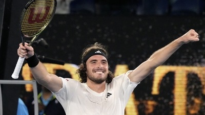 Stefanos Tsitsipas of Greece is congratulated by Jiri Lehecka, right, of the Czech Republic following their quarterfinal match at the Australian Open (AP)
