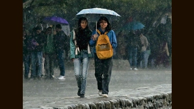 Girls taking a walk in the rain at Sukhna Lake in Chandigarh on Tuesday. (Ravi Kumar/HT) Girls taking a walk in the rain at Sukhna Lake in Chandigarh on Tuesday. (Ravi Kumar/HT)